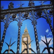 Big Ben as seen through the fence surrounding the Houses of Parliment