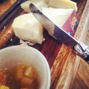 A close up of the cheese board.