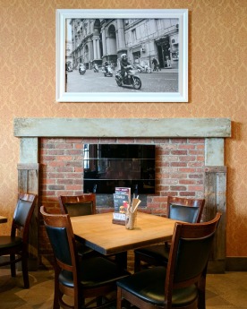 The central fireplace gives the place a homey feel.